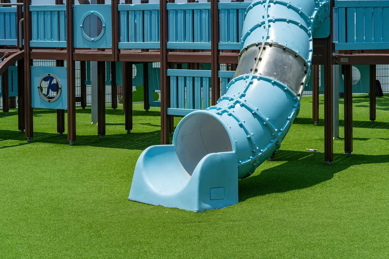 Artificial grass playground installation