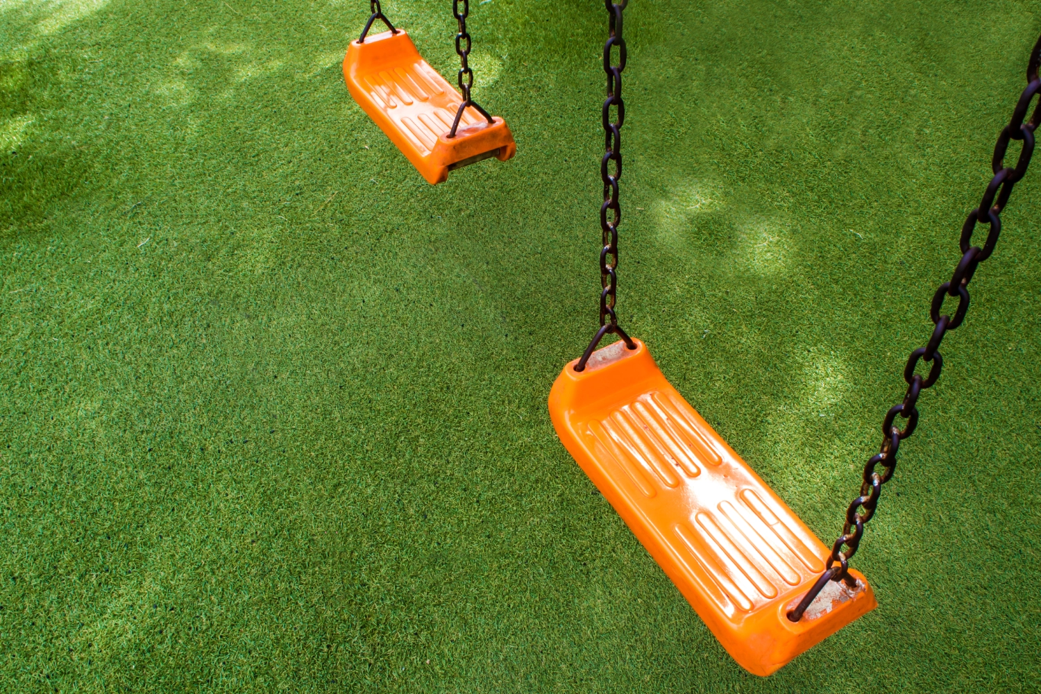 Artificial grass playground installation